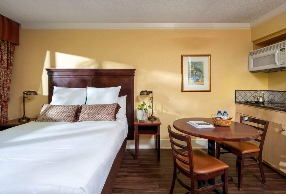 bed and dining area inside hotel room