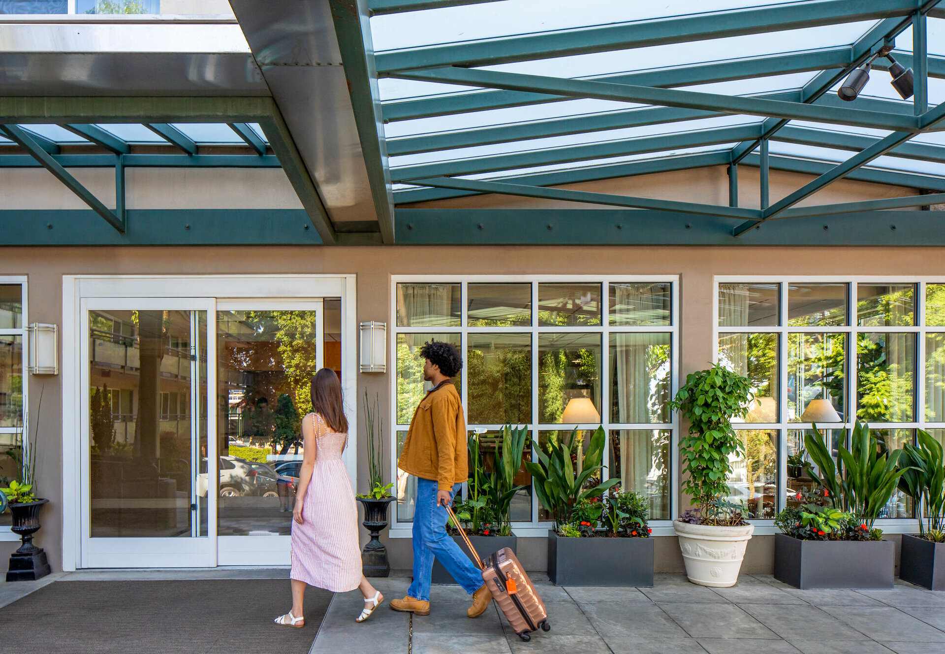 couple walking past entrance