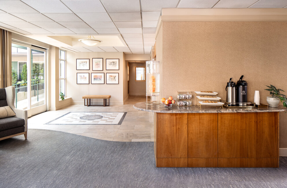 a room with a counter and a coffee maker